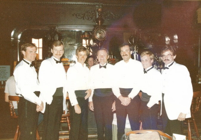 Dave, Pops and Groomsmen in front of the historic bar at The Palace Saloon